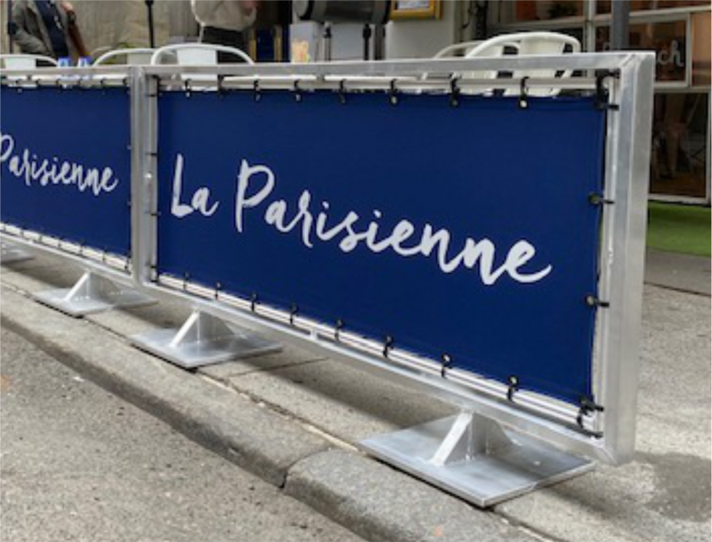 Tensioned fabric café barrier attached around the frame perimeter